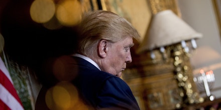 President Donald Trump pauses during a Christmas Eve video teleconference with members of the military at his Mar-a-Lago estate in Palm Beach, Fla., Tuesday, Dec. 24, 2019. (AP Photo/Andrew Harnik)