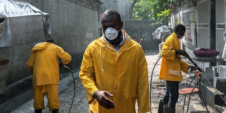 Officials carry out disinfection protocols to protect against the spreading of coronavirus in Port-au-Prince, Haiti, on April 6, 2020.