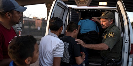 Migrants, mostly from Central America, board a van which will take them to a processing center, on May 16, 2019, in El Paso, Texas. - About 1,100 migrants from Central America and other countries are crossing into the El Paso border sector each day. US Customs and Border Protection Public Information Officer Frank Pino, says that Border Patrol resources and personnel are being stretched by the ongoing migrant crisis, and that the real targets of the Border Patrol are slipping through the cracks. (Photo by Paul Ratje / AFP)        (Photo credit should read PAUL RATJE/AFP via Getty Images)