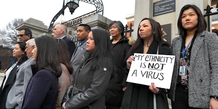 BOSTON, MA - MARCH 12: Members of the Asian American Commission hold a press conference on the steps of the Massachusetts State House to condemn racism towards the Asian American community because of coronavirus on March 12, 2020 in Boston. (Photo by John Tlumacki/The Boston Globe via Getty Images)