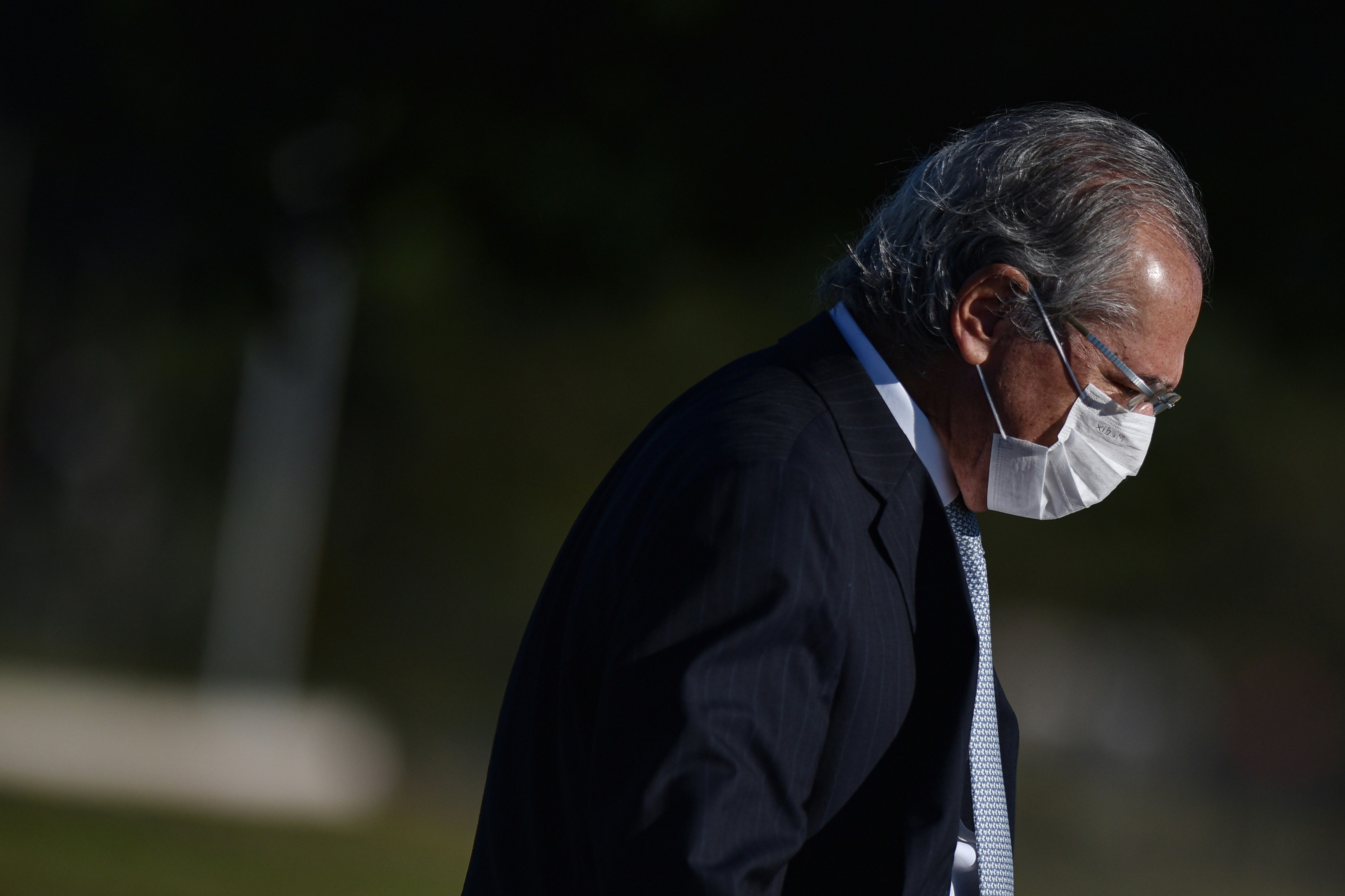 Paulo Guedes, Brazil's economy minister, wears a protective mask during the National Flag Raising ceremony at Alvorada Palace in Brasilia, Brazil, on Tuesday, May 12, 2020.