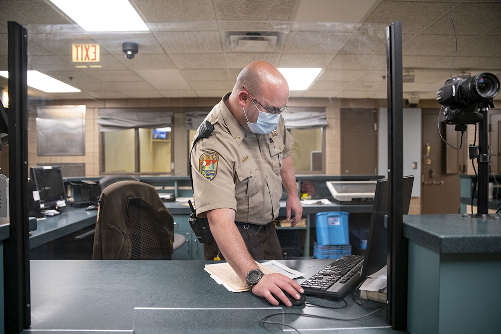 DULUTH, MN - APRIL 28: Corrections officer John Wohlwend donned a mask on Tuesday while working his shift at the St. Louis County jail. The St. Louis County jail population has fallen dramatically as fewer arrests are made, which has helped keep a COVID-19 outbreak at bay inside the prison. (Photo by Alex Kormann/Star Tribune via Getty Images)