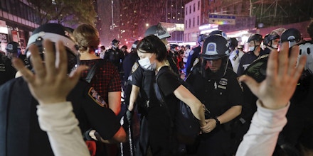 Police arrest protesters as they march through the streets of Manhattan, New York, Wednesday, June 3, 2020. New York City Mayor Bill de Blasio says that the city has taken a 