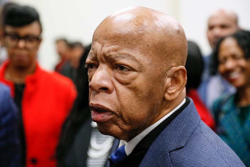 Congressman John Lewis talks with media members after signing paperwork to qualify for reelection