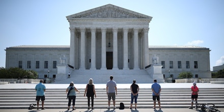 Anti-abortion demonstrators pray in front of the U.S. Supreme Court in Washington, D.C., on July 8, 2020.
