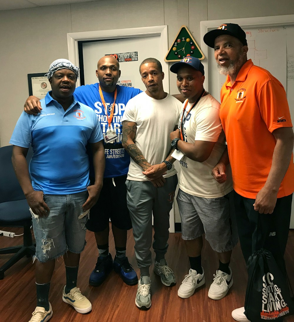 Safe Streets workers, from left: “Ice,” a Cherry Hill hospital responder; Dante Barksdale, outreach coordinator; “Reds”, another hospital responder; Elgin Maith, Director CHerry Hill Safe Streets; Denis Wise, former Director of Penn North Safe Streets.