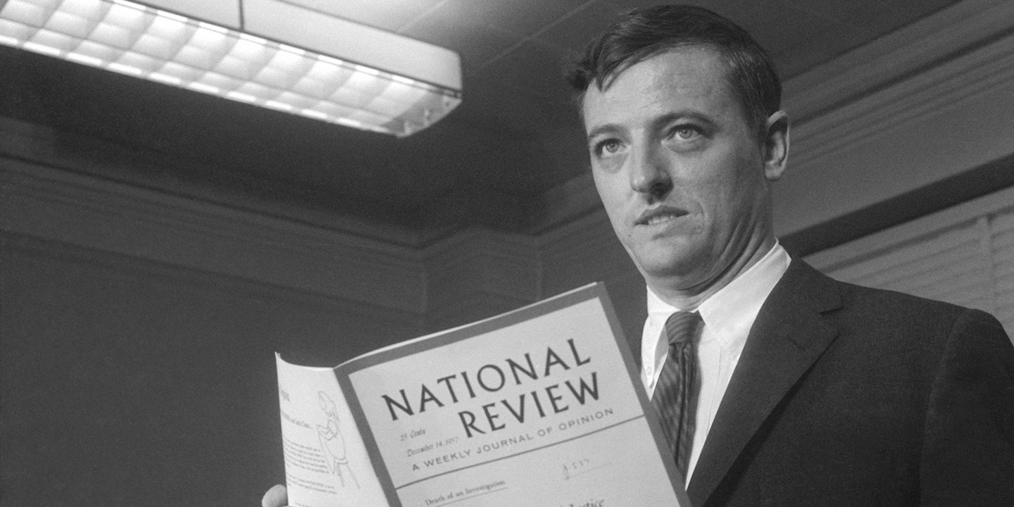 (Original Caption) Magazine editor William F. Buckley, Jr., editor of the National Review, holds a copy of the magazine as he makes a statement on the steps of the U.S. Courthouse. on the cover if the title of an article the magazine published, "The Wheels of Justice Stop for Adam Clayton Powell, Jr." Buckley, who admitted sending copies of the article to grand jury members investigating Powell, is facing charges of using improper influence on the jury.