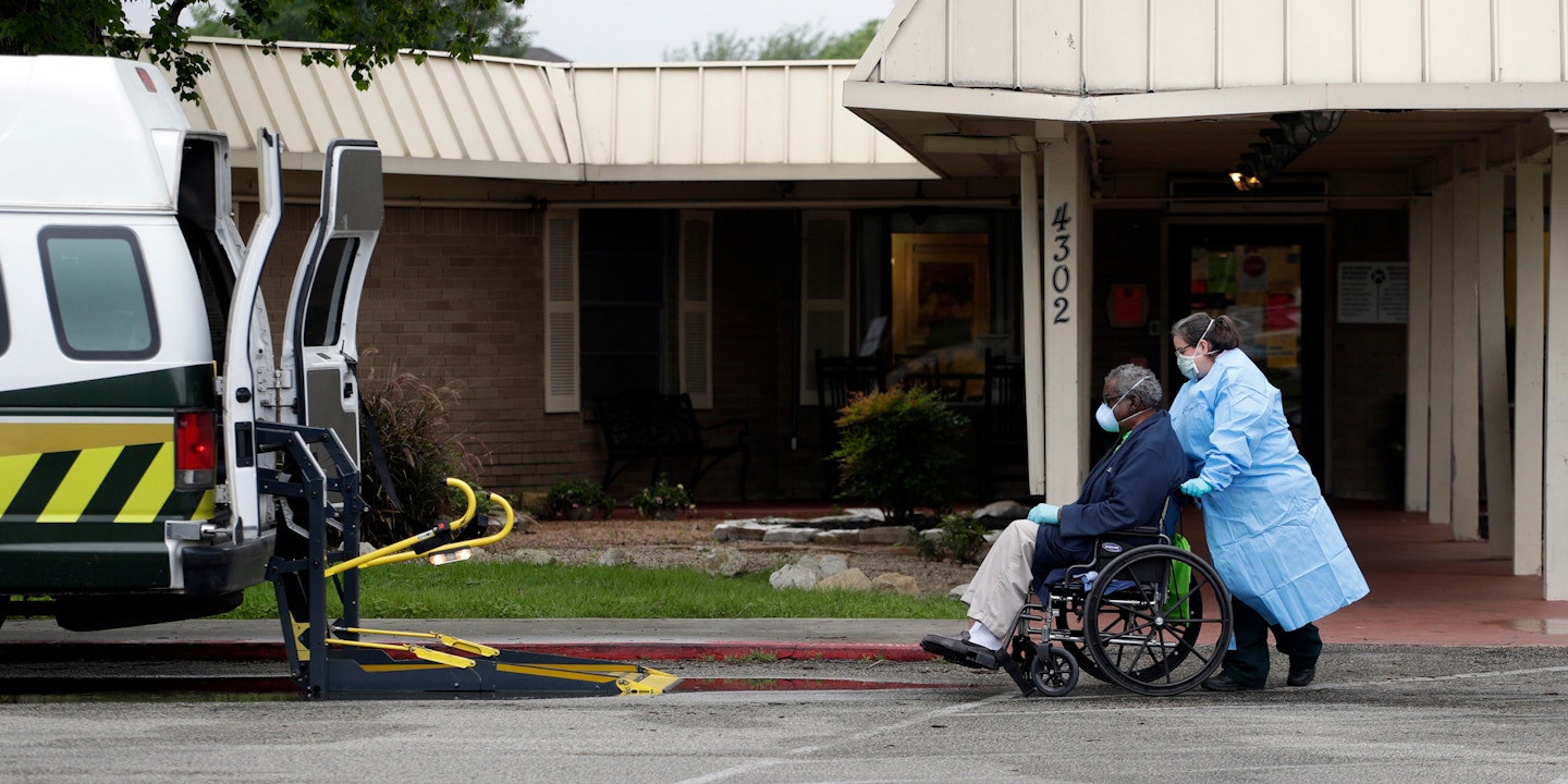 A resident is removed from the Southeast Nursing and Rehabilitation Center in San Antonio, Friday, April 3, 2020. More than 50 residents and staff have tested positive for COVID-19 at the facility. (AP Photo/Eric Gay)