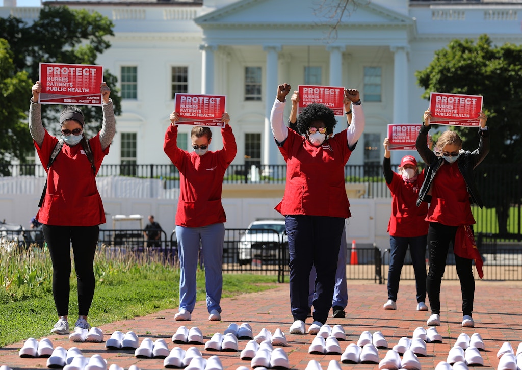 Members of the National Nurses United observe a moment of silence for the 88 nurses they say have died from COVID-19 while demonstrating in Lafayette Park across from the White House May 07, 2020 in Washington, DC.