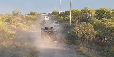 Border Patrol vehicles traveling on a dirt road in Arizona as part of a July 31, 2020, raid on the migrant humanitarian aid group No More Deaths