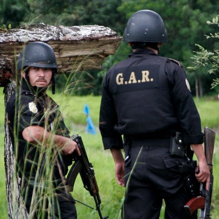 Armed Guatemalan police officers approach the community of La Revolución. In early 2007, the Guatemalan Nickel Company, then a subsidiary of Canada’s Skye Resources, expelled several Maya Q’eqchi’ communities from a huge swathe of land in northeastern Guatemala.