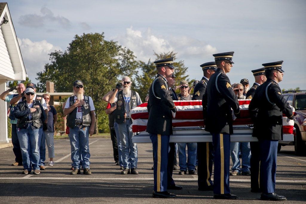 Patriot Guard Riders salute as military members carry the casket of Army Private Gregory Wedel-Morales at Green Hill Cemetery in Sapulpa on July 23, 2020.