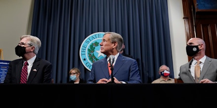 Texas Lt. Gov. Dan Patrick, left, Gov. Greg Abbott, and House Speaker Dennis Bonnen, right, attend a news conference where they provided an update to Texas’s response to Covid-19 in Austin on Sept. 17, 2020. 