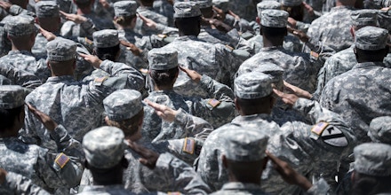 Soldiers listen to Taps during a memorial service at Fort Hood April 9, 2014 in Texas.