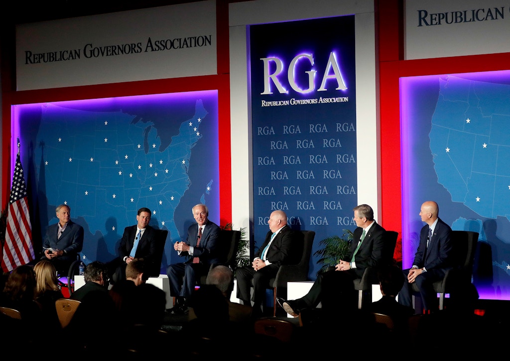 From left, Greg Abbott, Doug Ducey, Asa Hutchinson, Larry Hogan, Charlie Baker, and Pete Ricketts participate in the Republican Governors Association annual conference in Scottsdale, Ariz., on Nov. 28, 2018.