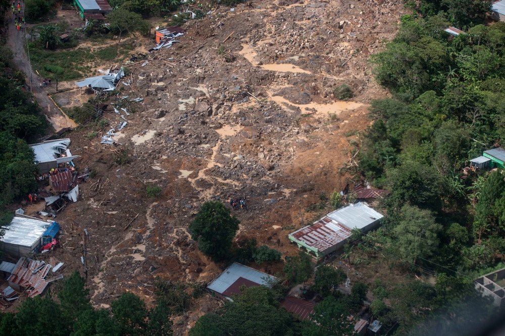 An aerial view of the massive, rain-fueled landslide in the village of Queja, in Guatemala, Saturday, Nov. 7, 2020, in the aftermath of Tropical Storm Eta. (Esteban Biba/Pool Photo via AP)