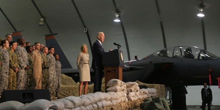 U.S. Vice President Joe Biden speaks to the U.S. military personnel next to his wife Dr. Jill at a Air Base in United Arab Emirates, Monday, March 7, 2016. (AP Photo/Kamran Jebreili)