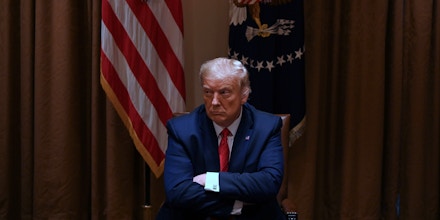 TOPSHOT - US President Donald Trump sits before holding a roundtable discussion with several Administration officials and Hispanic American business, community, and education leaders in the cabinet room at the White House on July 9, 2020 in Washington,DC. (Photo by JIM WATSON / AFP) (Photo by JIM WATSON/AFP via Getty Images)