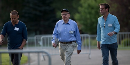 Lachlan Murdoch, a board member of News Corp., from left, Rupert Murdoch, chairman and chief executive officer of News Corp., and James Murdoch, deputy chief operating officer of News Corp., walk to the morning session at the Allen & Co. Media and Technology Conference in Sun Valley, Idaho, U.S., on Wednesday, July 10, 2013. Executives from media, finance and politics mingle at the mountain resort between presentations on business trends and social issues, brought together by New York investment banker Herb Allen. Photographer: Scott Eells/Bloomberg via Getty Images