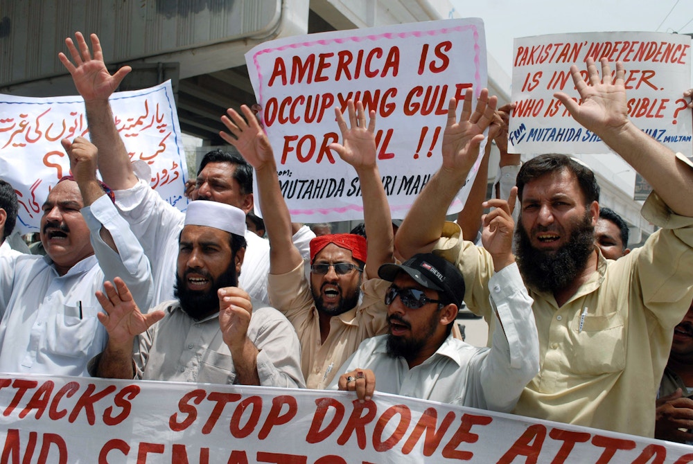 Pakistani protesters belonging to United Citizen Action shout anti-US slogans during a protest in Multan on June 10, 2011 against the US drone attacks in Pakistani tribal areas. Thirteen attacks have been reported in Pakistan's tribal belt since US commandos found and killed Al-Qaeda founder, Osama bin Laden in the Pakistani garrison city of Abbottabad, before flying off with his body and burying it at sea. Washington has called Pakistan's semi-autonomous northwest tribal region the most dangerous place on earth and the global headquarters of Al-Qaeda, where Taliban and other Al-Qaeda-linked networks have carved out strongholds. AFP PHOTO/ S.S. MIRZA (Photo by S.S. MIRZA / AFP) (Photo by S.S. MIRZA/AFP via Getty Images)