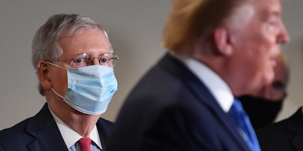 Senate Majority Leader Mitch McConnell wears a protective mask as U.S. President Donald Trump speaks to members of the media at the Hart Senate Office Building in Washington, D.C., on May 19, 2020.