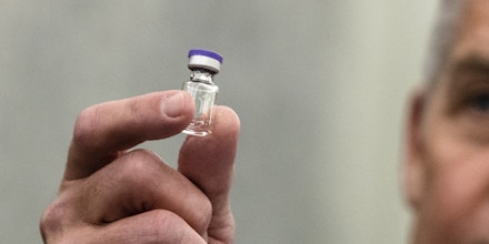 Wes Wheeler, president of healthcare logistics at United Parcel Service Inc. (UPS), holds an example of the Pfizer Covid-19 vaccine vial during a Senate Commerce Committee hearing in Washington, D.C., U.S., on Thursday, Dec. 10, 2020. The hearing examines the logistics of transporting a Covid-19 vaccine. Photographer: Samuel Corum/The New York Times/Bloomberg via Getty Images
