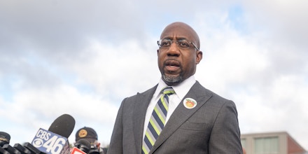 Democratic nominee for U.S. Senate Rev. Raphael Warnock casts his vote in the runoff election on the first day of early voting on December 14, 2020 in Atlanta, Georgia.