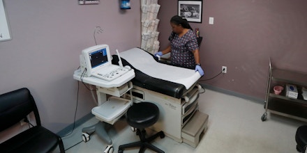 FILE - In this Sept. 4, 2019 file photo, Director of Clinical Services Marva Sadler, prepares the operating room at the Whole Woman's Health clinic in Fort Worth, Texas. On Tuesday, April 7, 2020, the 5th U.S. Circuit Court of Appeals held 2-1 that the state's restrictions on abortions could remain in place during the COVID-19 coronavirus pandemic. (AP Photo/Tony Gutierrez)