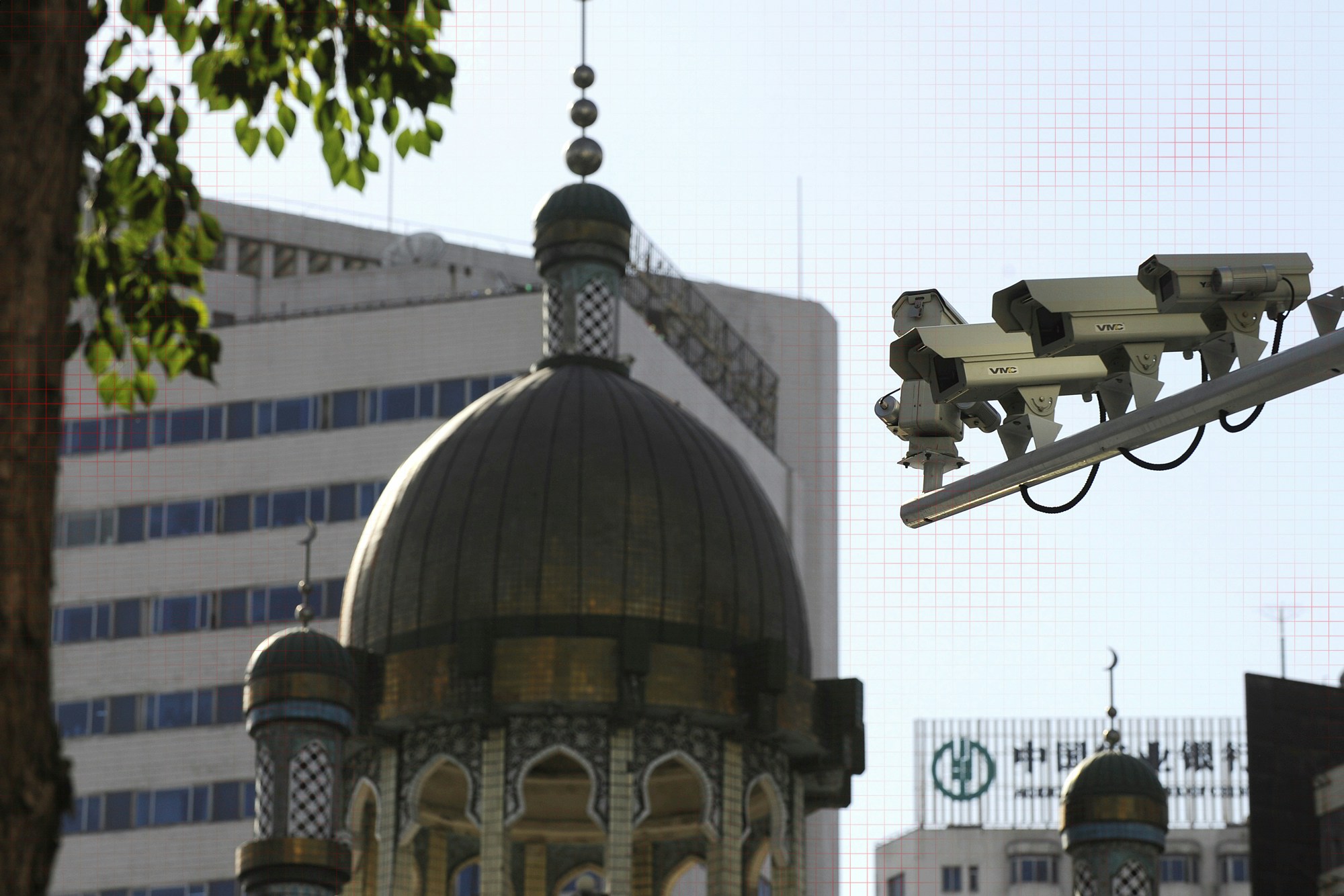 Security cameras are seen (R) on a street in Urumqi, capital of China's Xinjiang region on July 2, 2010.