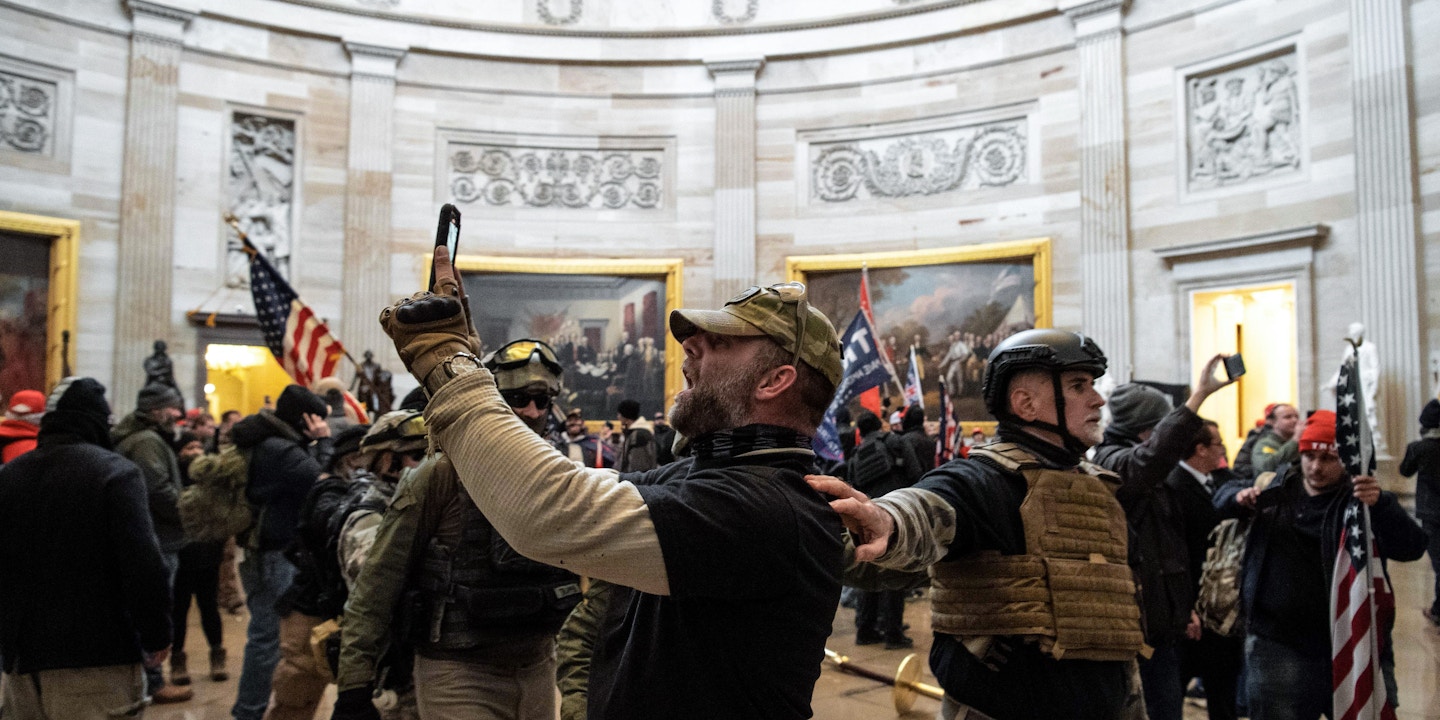 Supporters of US President Donald Trump protest inside the US Capitol on January 6, 2021, in Washington, DC. - Demonstrators breeched security and entered the Capitol as Congress debated the a 2020 presidential election Electoral Vote Certification. (Photo by SAUL LOEB / AFP) (Photo by SAUL LOEB/AFP via Getty Images)