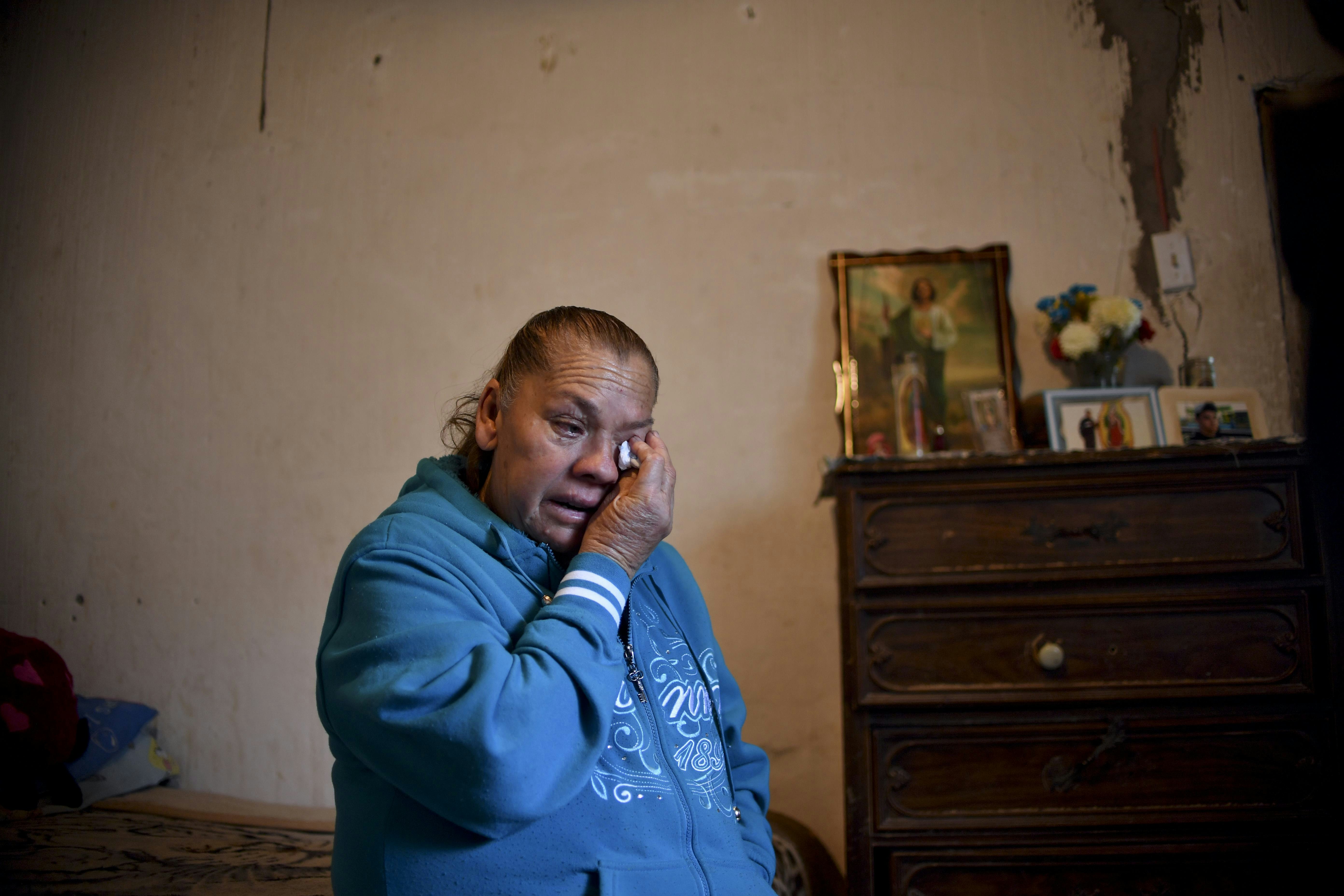 Maria Guadalupe Guereca, 60, cries while remembering her murdered son Sergio Hernandez, during an interview with AFP at her house in Ciudad Juarez, Chihuahua, Mexico, on February 18, 2017. The shooting occurred June 7, 2010 while Sergio Hernandez was spending time with three friends on the banks of the Rio Grande, which separates Ciudad Juarez in Mexico from El Paso in Texas, US. Sergio was shot dead at 15 by police officer Jesus Mesa. This would have been another tale of tragic and banal violence, had the victim not been in Mexico and the perpetrator in the United States. / AFP / Yuri CORTEZ        (Photo credit should read YURI CORTEZ/AFP via Getty Images)