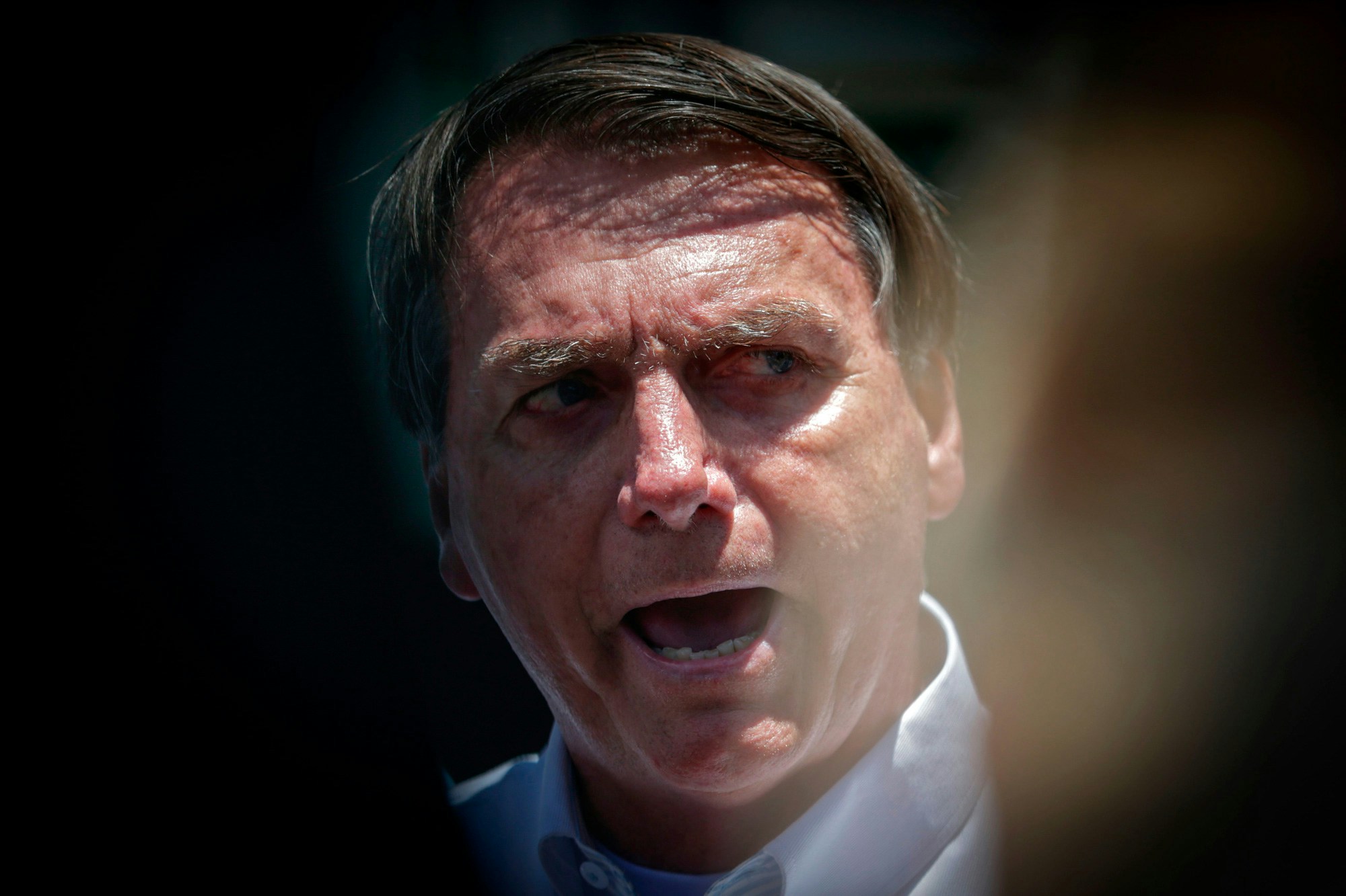 Brazilian President Jair Bolsonaro speaks to the press after voting during the second round of municipal elections at the Rosa da Fonseca Municipal School, in the Military Village, Rio de Janeiro, Brazil, on November 29, 2020. - Brazilians go to the polls Sunday to chose mayors in 57 cities, including Sao Paulo and Rio de Janeiro, the most rich and populated, in a runoff marked by the economic crisis and an upsurge of the new coronavirus. (Photo by Andre Coelho / AFP) (Photo by ANDRE COELHO/AFP via Getty Images)