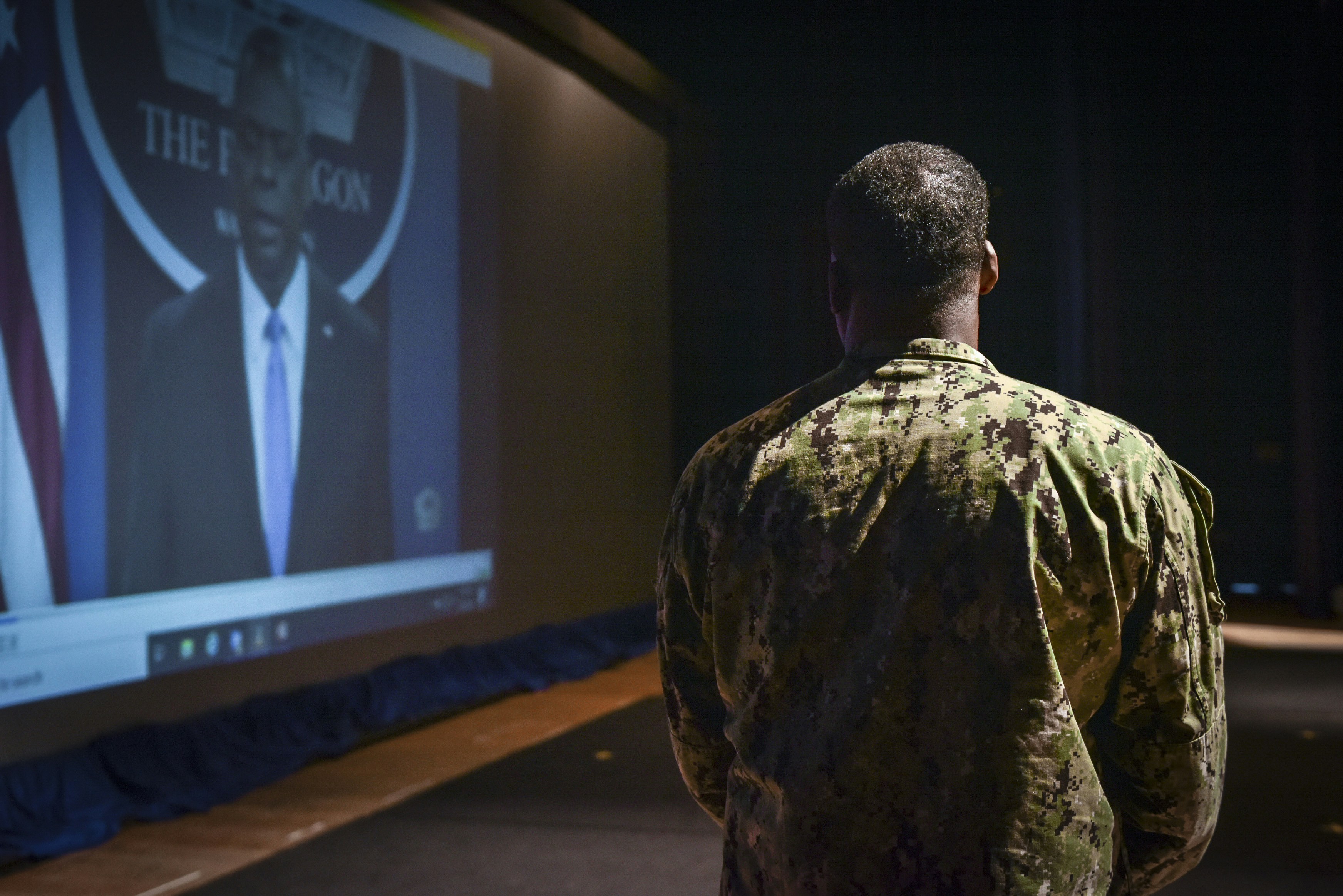 VIRGINIA BEACH, Va. (March 1, 2021) Capt. Michael Witherspoon watches a video of Secretary of Defense Lloyd Austin address extremism within the U.S. military during a mandated stand-down, March 1. The SECDEF directed commanding officers and supervisors at all levels to conduct a stand-down with their personnel to address extremism by April 6, 2021. (U.S. Navy photo by Travis J. Kuykendall/Released)