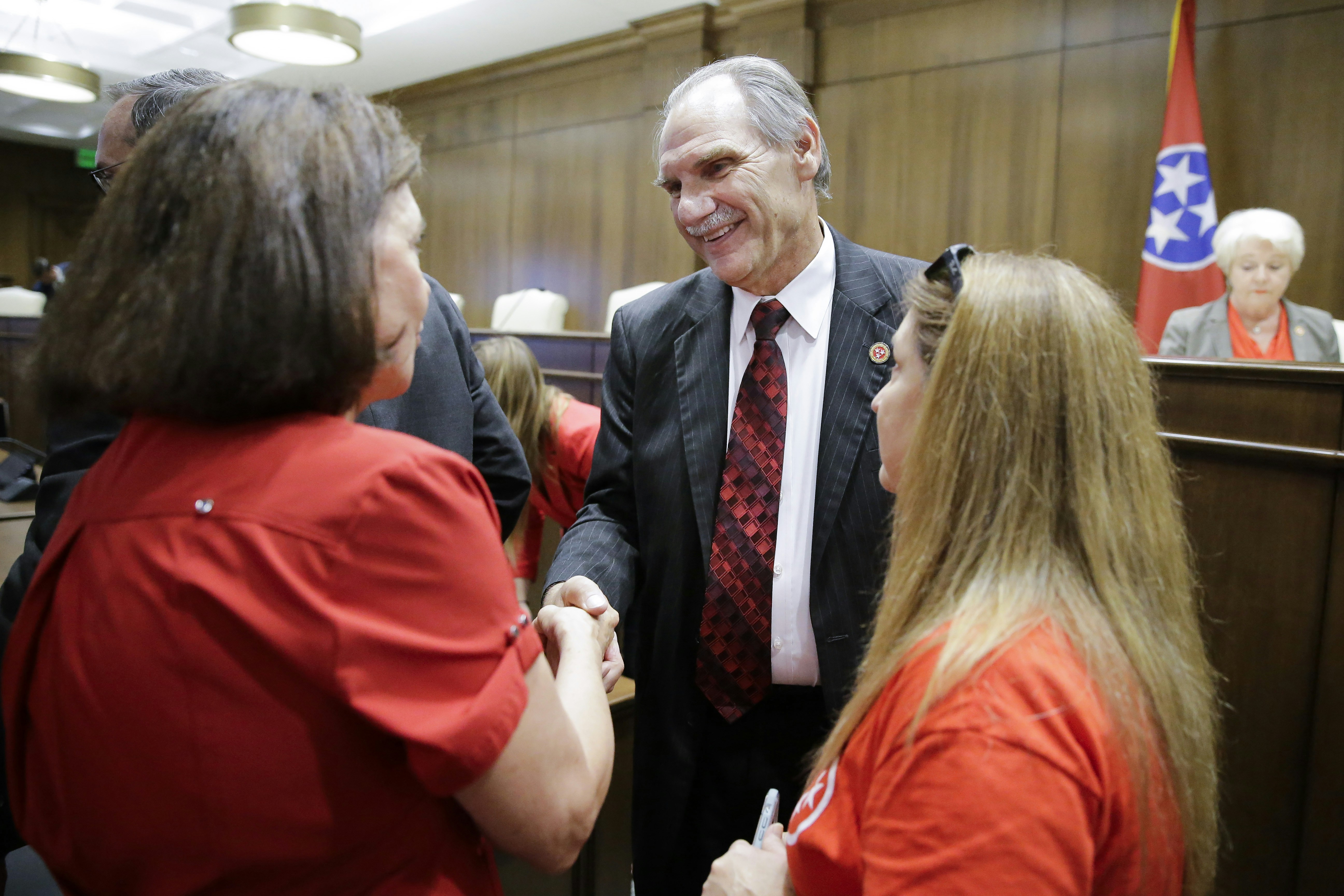 Sen. Mark Pody, R-Lebanon, talks with people attending a Senate hearing to discuss a fetal heartbeat abortion ban, or possibly something more restrictive, Monday, Aug. 12, 2019, in Nashville, Tenn. (AP Photo/Mark Humphrey)