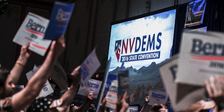 In a Saturday, May 14, 2016 photo, supporters of Democratic presidential candidate Bernie Sanders crowd the front of the room during the Nevada State Democratic Party’s 2016 State Convention at the Paris hotel-casino in Las Vegas. The Nevada Democratic Convention turned into an unruly and unpredictable event, after tension with organizers led to some Bernie Sanders supporters throwing chairs and to security clearing the room, organizers said. (Chase Stevens/Las Vegas Review-Journal via AP) LOCAL TELEVISION OUT; LOCAL INTERNET OUT; LAS VEGAS SUN OUT