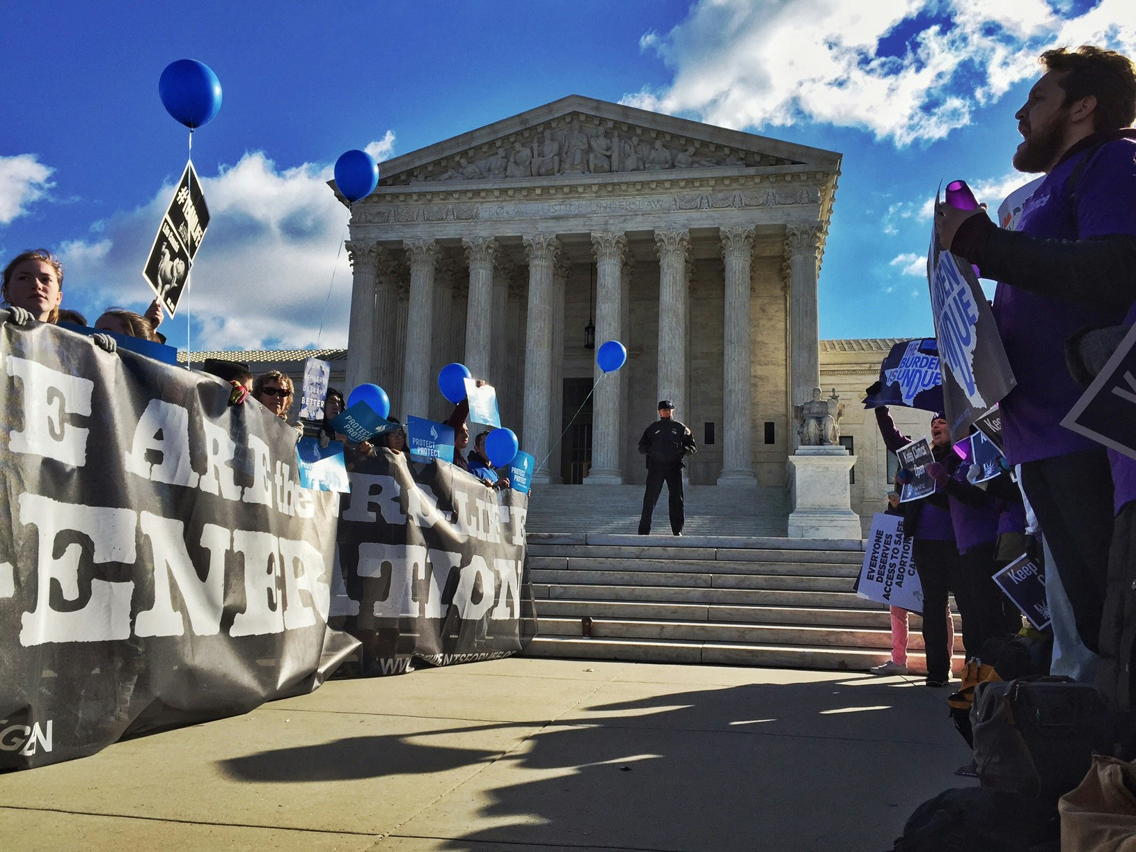 WASHINGTON, DC - MARCH 2: Pro-choice advocates, right, face off against anti-abortion supporters during a rally at the Supreme Court Wednesday March 2, 2016, as Justices hear a case concerning a Texas law regulating abortion clinics and providers. (Photo by Bill O'Leary/The Washington Post via Getty Images)