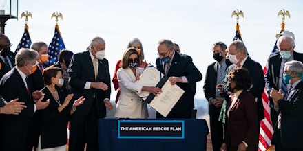 WASHINGTON, DC - MARCH 10: Speaker of the House Nancy Pelosi (D-CA) and Senate Majority Leader Chuck Schumer (D-NY) sign H.R. 1319 American Rescue Plan Act of 2021during a bill enrollment ceremony on Capitol Hill on Wednesday, March 10, 2021 in Washington, DC.  (Kent Nishimura / Los Angeles Times via Getty Images)