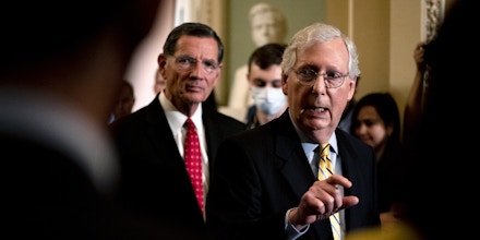 Senate Minority Leader Mitch McConnell, a Republican from Kentucky, right, speaks during a news conference following Senate Republican policy luncheons at the U.S. Capitol in Washington, D.C., U.S., on Tuesday, June 22, 2021. Top White House aides wrapped up a meeting with group of senators Tuesday without producing an infrastructure compromise, as differences on how to pay for a proposed $579 billion in new spending for roads, bridges and other projects continue to bedevil the talks. Photographer: Stefani Reynolds/Bloomberg via Getty Images