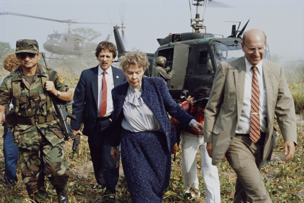 American ambassadors Jeane Kirkpatrick (1926 - 2006) and Thomas R. Pickering in El Salvador, during the Salvadoran Civil War, 1985.  (Photo by Scott Wallace/Getty Images)