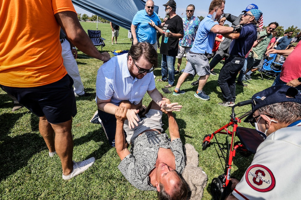 Irvine, CA, Sunday, July 11, 2021 - A brief scuffle breaks out involving a few opponents of Representative Katie Porter (D-CA45) as she conducts a town hall meeting with constituents at Mike Ward Community Park. (Robert Gauthier/Los Angeles Times via Getty Images)
