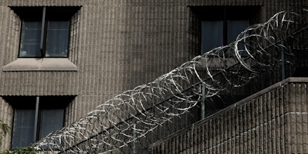 A barbed wire fence is seen outside the Metropolitan Correctional Center in New York, U.S., on July 31, 2019.