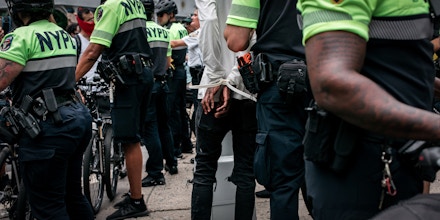 NEW YORK, NY - JUNE 11: A protester is arrested by NYPD officers during a march against police brutality on June 11, 2020 in New York City. Demonstrations against systemic racism have continued for over two weeks since the killing of George Floyd, an unarmed black man, by a Minneapolis Police officer on May 25th.(Photo by Scott Heins/Getty Images)