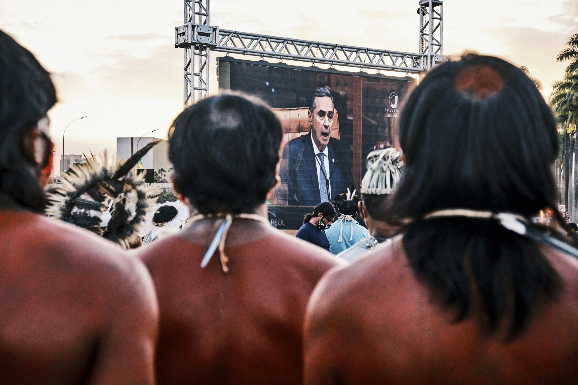 A screen shows Supreme Court Justice Luis Roberto Barroso during a protest against a land demarcation judgment outside the Supreme Court building in Brasilia, Brazil, on Wednesday, Aug. 25, 2021. Indigenous protesters have gathered in Brasilia this week to protest a Supreme Court judgment on Wednesday that could take away ancestral lands. Photographer: Gustavo Minas/Bloomberg via Getty Images