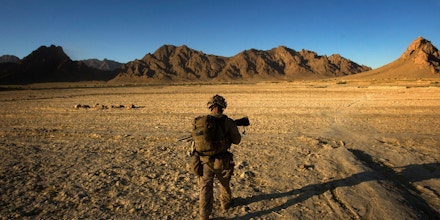 A U.S. Marine patrols as his platoon searches house to house during day three of Operation Germinate in Farah Province, Afghanistan, on Oct. 9, 2009.