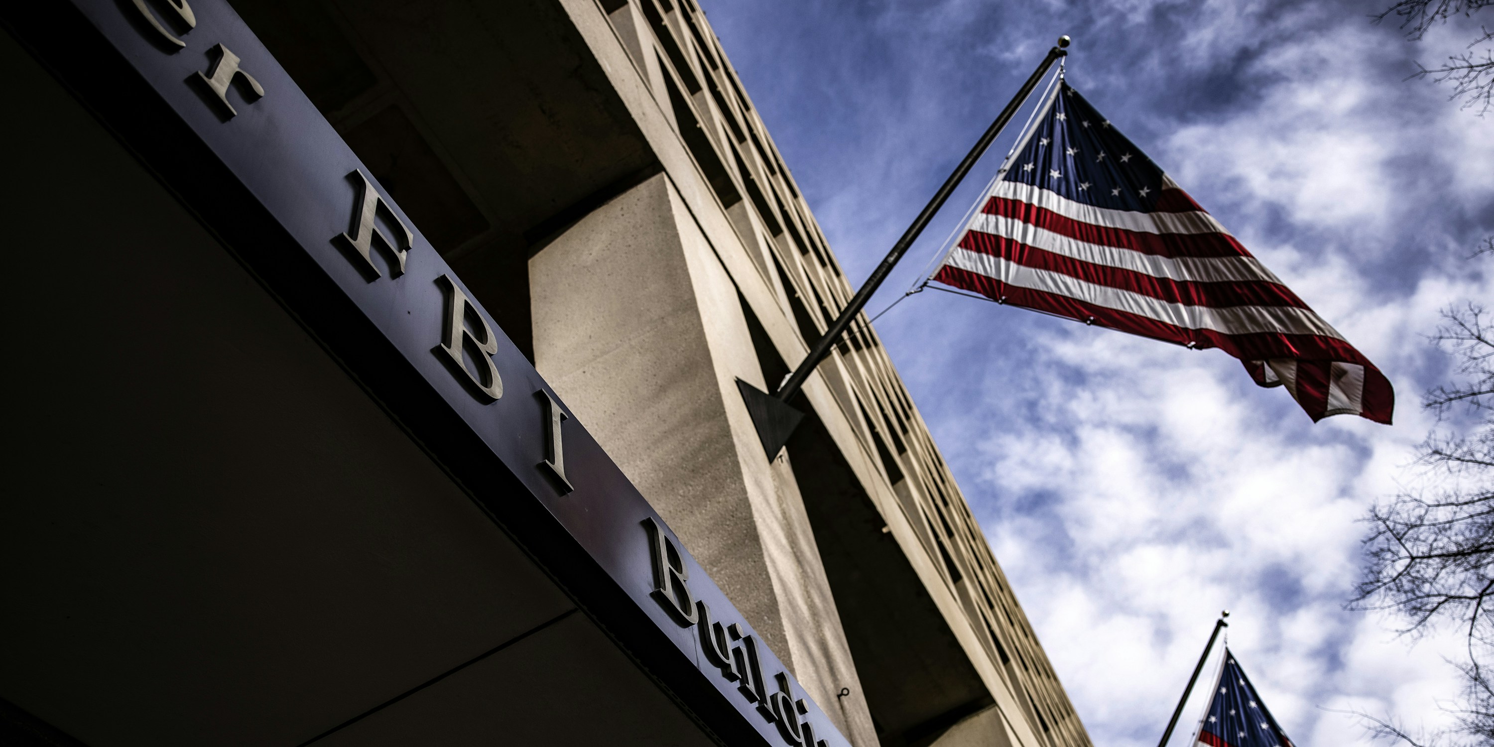 American flags fly outside FBI headquarters in Washington, D.C., on Jan. 2, 2021.