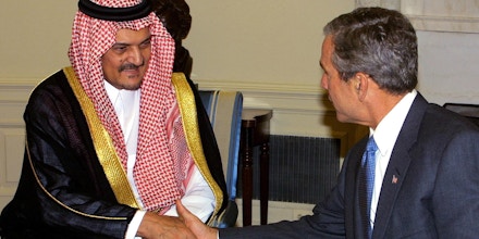 US President George W. Bush (R) meets with Kingdom of Saudi Arabia's Foreign Minister Saud al-Faisal (L) 20 September 2001 in the Oval Office of the White House in Washington, DC.