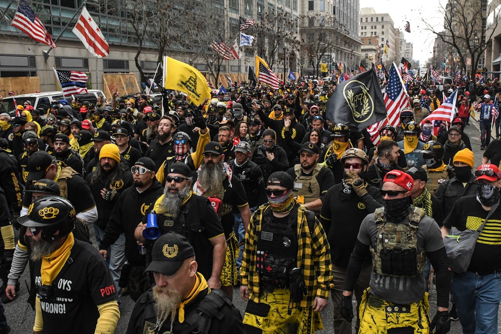 WASHINGTON, DC - DECEMBER 12: Members of the Proud Boys march towards Freedom Plaza during a protest on December 12, 2020 in Washington, DC. Thousands of protesters who refuse to accept that President-elect Joe Biden won the election are rallying ahead of the electoral college vote to make Trump's 306-to-232 loss official. (Photo by Stephanie Keith/Getty Images)