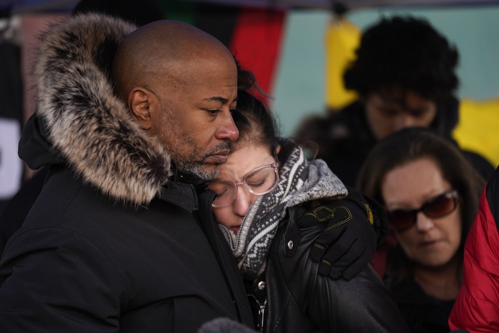 Bishop Tavis Grant consoles Hannah Gittings, girlfriend of Anthony Huber, who was fatally shot by Kyle Rittenhouse, Friday, Nov. 19, 2021, in Kenosha, Wis. Rittenhouse was acquitted of all charges after pleading self-defense in the deadly Kenosha shootings that became a flashpoint in the nation's debate over guns, vigilantism and racial injustice. (AP Photo/Paul Sancya)