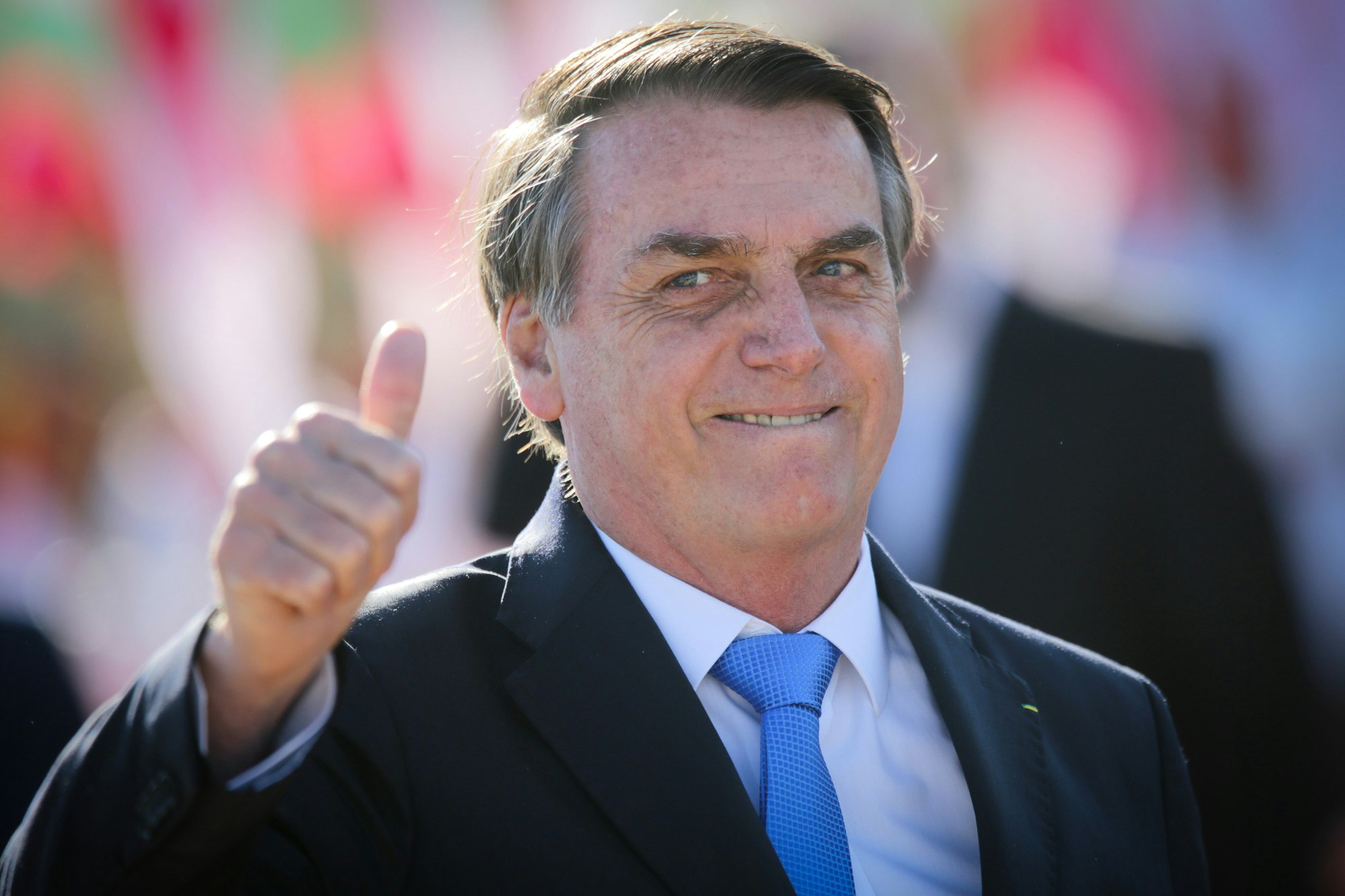 Jair Bolsonaro, Brazil's president, gives a thumbs up as Sebastian Pinera, Chile's president, not pictured, departs after a joint press conference at the Alvorada Palace in Brasilia, Brazil, on Wednesday, Aug. 28, 2019. Bolsonaro's environmental policies have come under pressure as more than 75,000 fires have swept across the country this year, an 84% increase compared to last year, according to the country's National Institute for Space Research. Photographer: Andre Coelho/Bloomberg via Getty Images