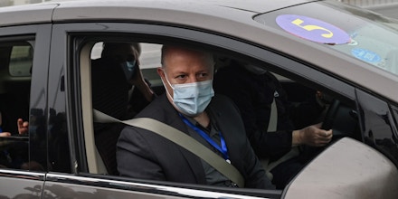 Peter Daszak (R), Thea Fischer (L) and other members of the World Health Organization (WHO) team investigating the origins of the COVID-19 coronavirus, arrive at the Wuhan Institute of Virology in Wuhan in China's central Hubei province on February 3, 2021. (Photo by Hector RETAMAL / AFP) (Photo by HECTOR RETAMAL/AFP via Getty Images)